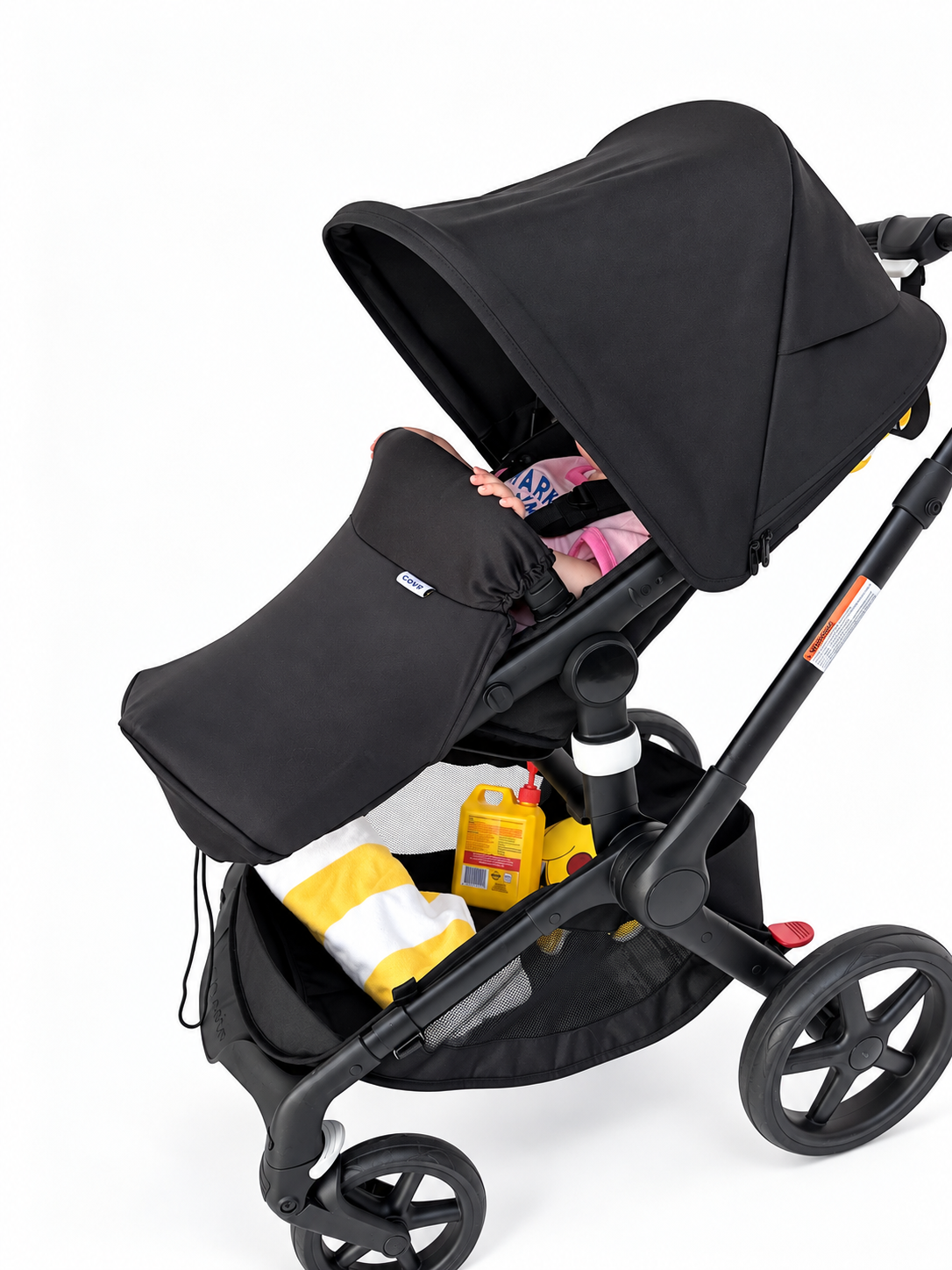 Side view of the COVR Signature Shade covering a baby's legs in a pram