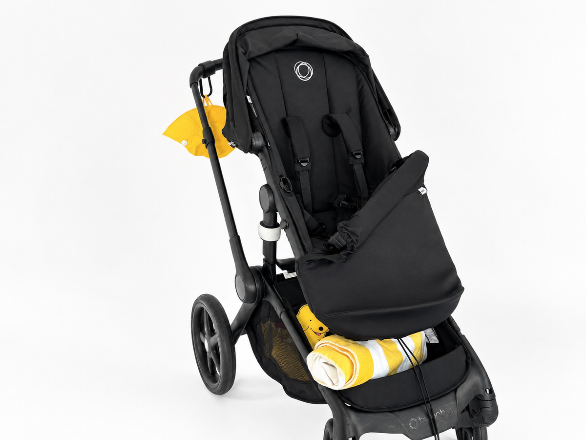 COVR Signature Shade folded down on the pram's bumper bar