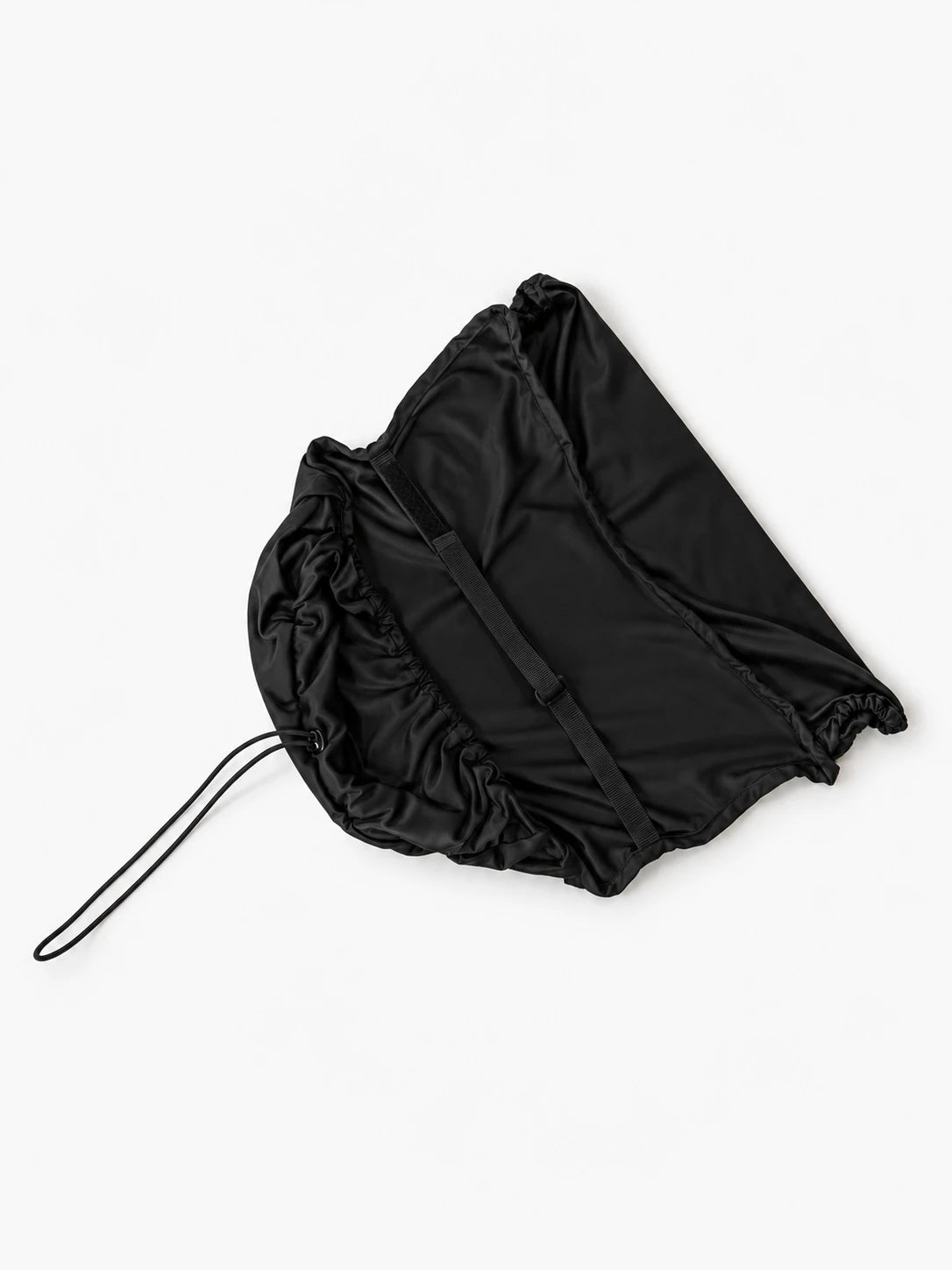 Underside of the COVR Signature Shade laid flat, showing the securing strap and drawcord