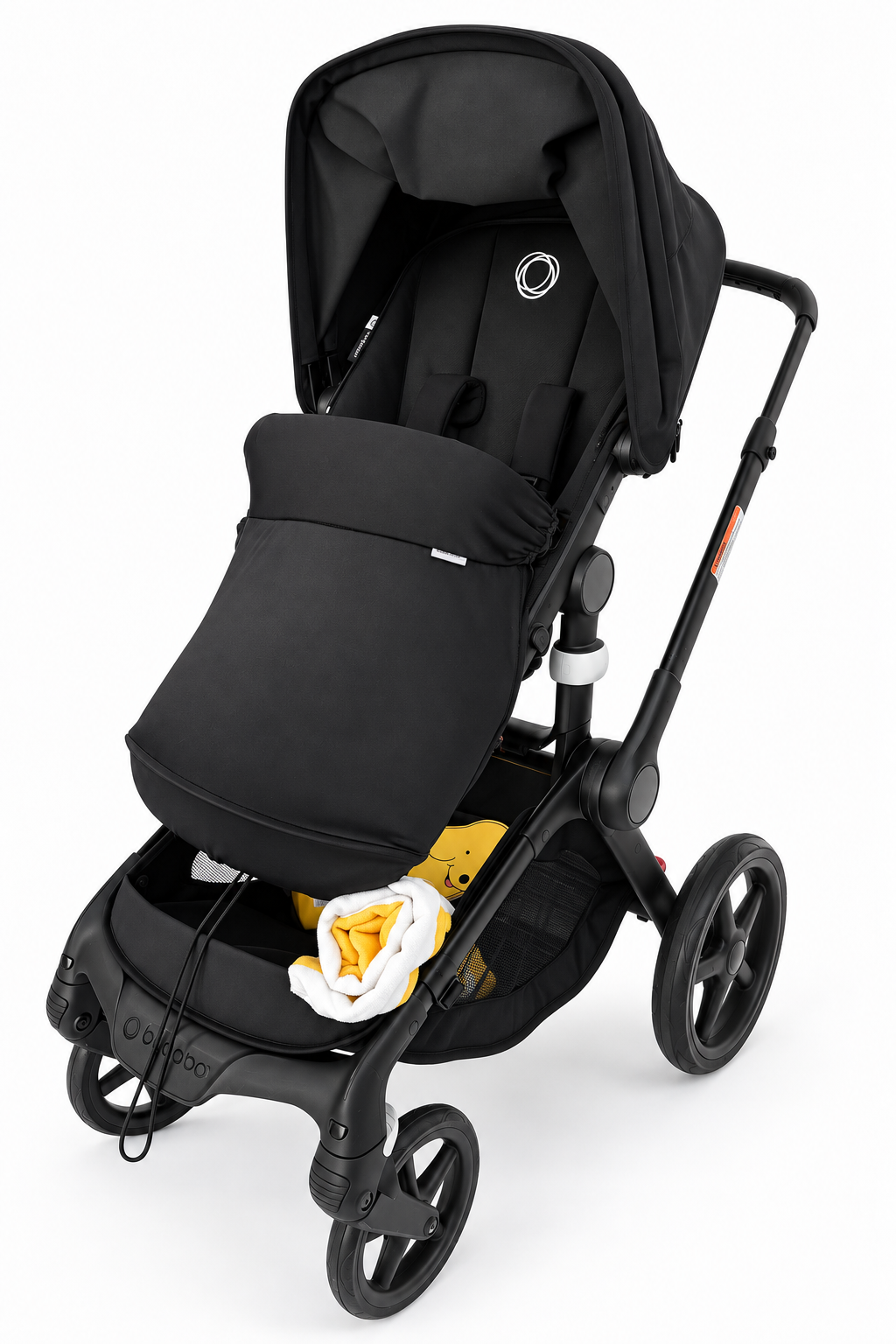 COVR Signature Shade fitted across the leg area of a black pram